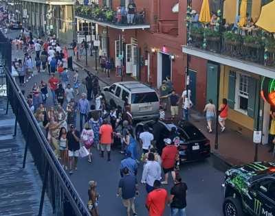 sexy woman flashes multiple times on bourbon street.