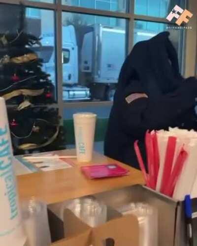 Security guard throws smoothie at worker.