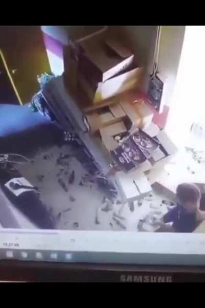 Fetching bottle from top shelf in the back room