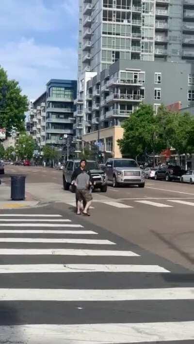 Guy with camouflage shorts and flip flops walks dude down and tries to handle business with his lethal mixed martial arts.