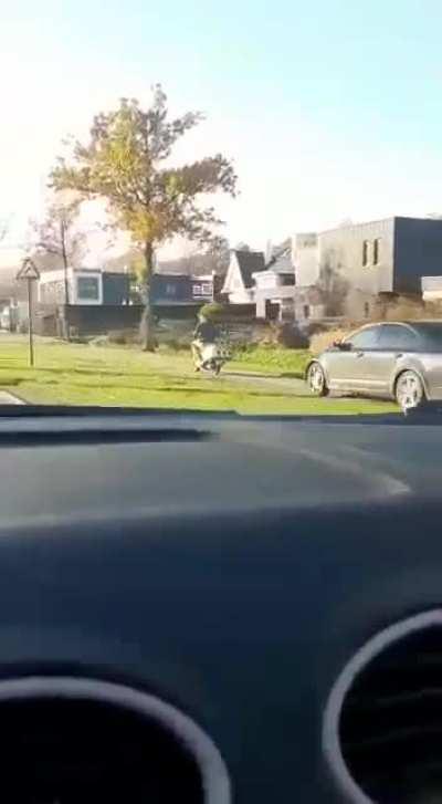 Undercover Cop chasing a scooter on the bicycle path