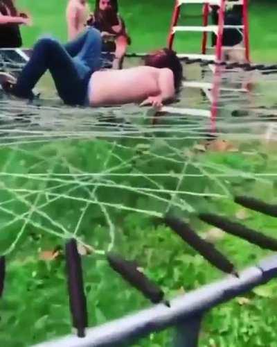 Idiot jumps into a barbwire trampoline