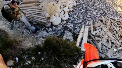 BASE jumping a mini bike off a cliff.