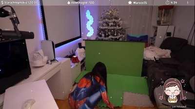 ivy setting up her green screen in her spiderman outfit