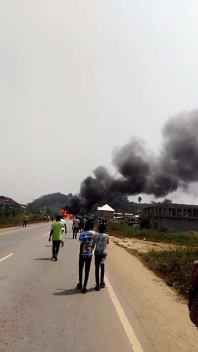 A mining truck carrying explosives explodes after colliding with a motorcycle