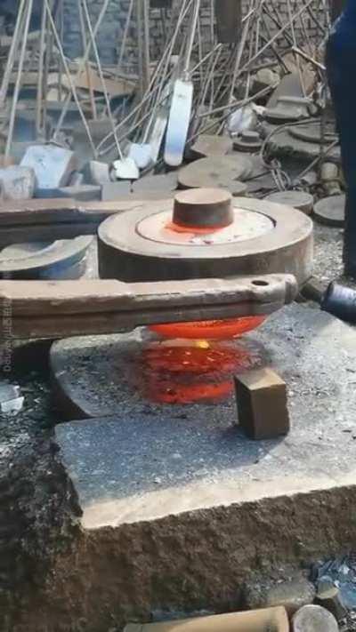 This die forging process is lit.