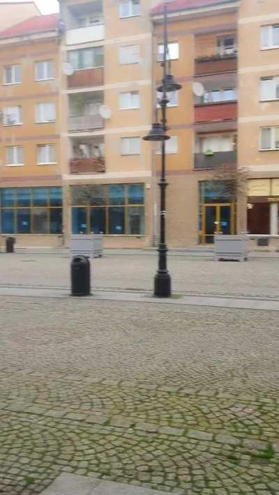 BOOM! And with just such a decisive step I walk out into the old town square. And my big boobs along with me. Heh