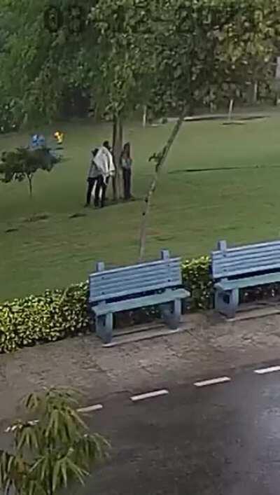 WCGW standing under a tree in a thunderstorm
