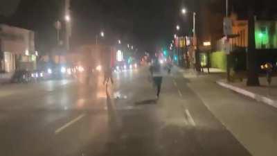 BLM protesters surround a truck, hitting it and trying to open its doors before it drives away