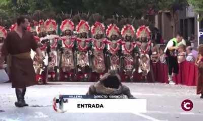 A guy disguised as an alligator in the procession 