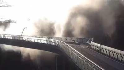to destroy a pedestrian bridge in Kyiv, Ukraine