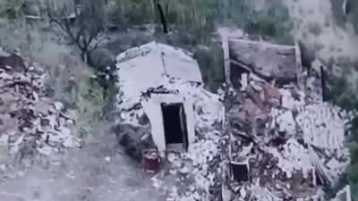 An Ukrainian soldier throws a TM-62 antitank mine into a basement used by russian forces.