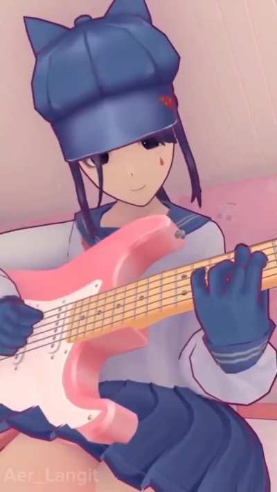 Cappie playing a guitar