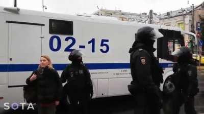 In Moscow, police detain a girl and take her to the paddy wagon, moments later terrible screams were heard from inside. Russian police then order others to leave the area and stop recording.