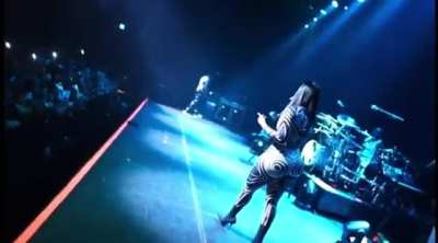 Queen walking from under on stage