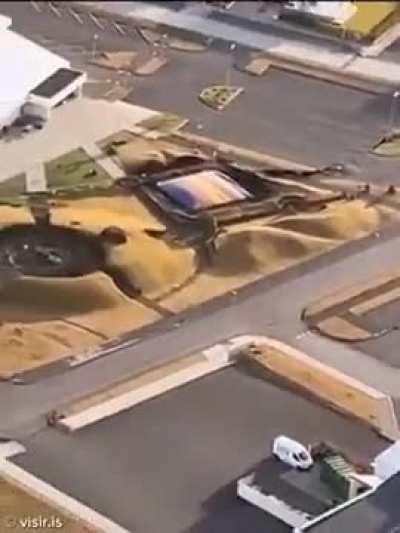 TODAY: New aerial images of Grindavik, Iceland, show a large crack in the center of the city with steam apparently emanating from it.