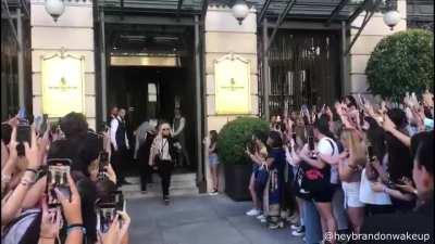 Man parked his car right next to where Harry Styles is supposed to come out of a hotel, so he pretended to be a celebrity trying to hide from all the fans