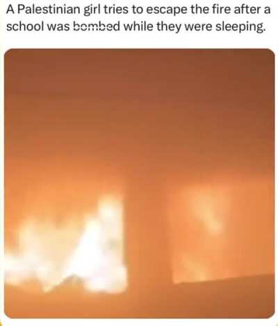 A Palestinian child tries to escape from the burning school after it was bombed by Israel