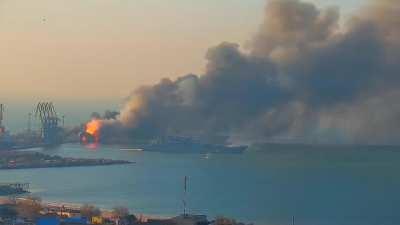 Run, boy, Run! A Ropucha-I class Russian Navy transport ship runs away, deck partially afire.