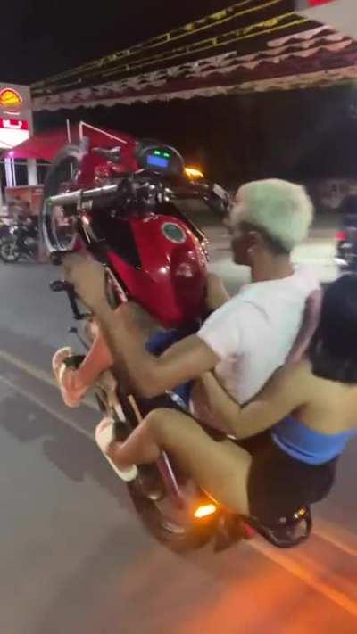 WCGW doing bike tricks with a passenger