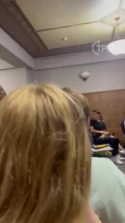 Dude loses his shit and attacks a projector after watching a meme with Kamala Harris