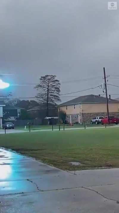 Massive electrical sparks fly across power lines in Louisiana as dangerous weather batters the region.