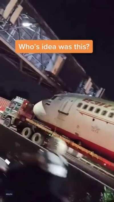 A job failed successfully... Air India's aircraft damaged and struck on foot over bridge in New Delhi, India....... while being transported to another location