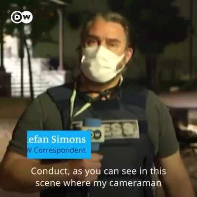 Police shooting and threatening german reporters