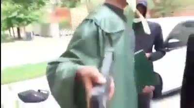 high school graduates showing off their glocks..really?