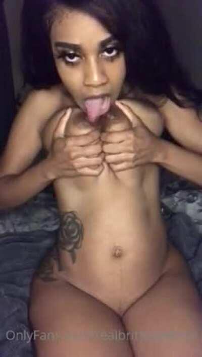 Brittney White licking her own tits
