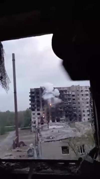 Ukrainian soldiers fire on a house with Russians forces using a thermobaric infantry grenade launcher. Toretsk, Donetsk region.