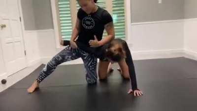 Shayna Baszler (With help from Dakota Kai) shows how you do a crossface.