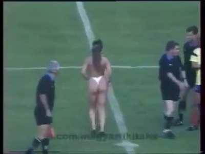 1990, A topless woman ceremonially kicks off a match between Hungary and Colombia to celebrate the fall of communism and the liberation of women in Hungary.