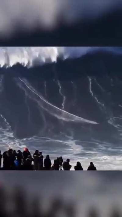 German Surfer Rides a Tsunami Like Wave..