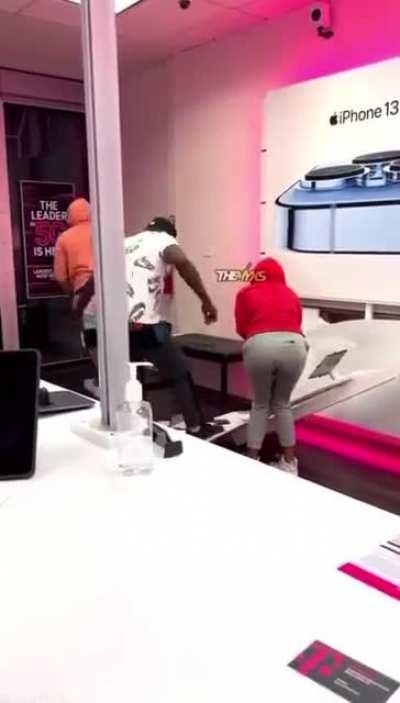 Three people destroying properties and stealing iPhones.