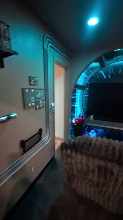 Would you want to hang out and watch a few movies in this entertainment/theater room?