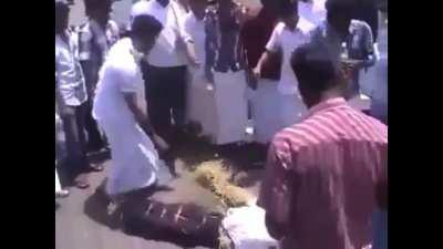 Using Petrol to light a protest effigy