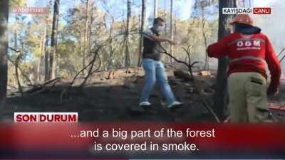 Helicopter drops water on reporter