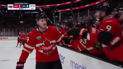 [CAN (1)-0 USA] MacKinnon's shot finds the back of the net through the crowd to open the scoring