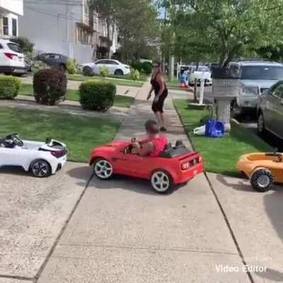 Kid driving like a boss in his electric toy car
