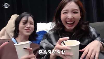 Nayeon and Mina dramatically enjoying their drink!