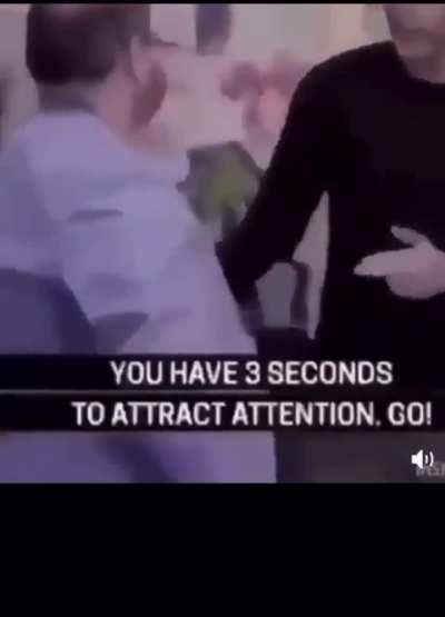 You've spotted a terrorist, now attract attention without letting him know you're attracting attention to him