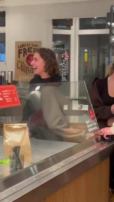 Moon Hooch band member playing a saxophone with traffic cone appendage