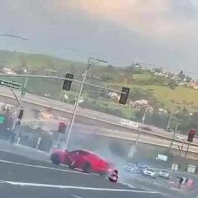 Hanging out the window of a drifting car.