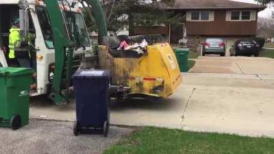 This unique garbage truck has a special feature