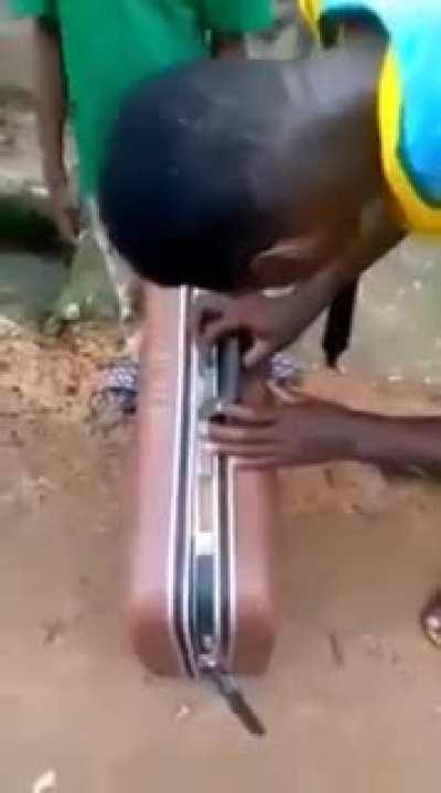 kid locked his friend inside a suitcase