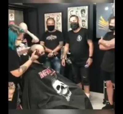 The dude went to the barber shop to shave his head due to cancer treatment and his barber and everyone at the shop do this...
