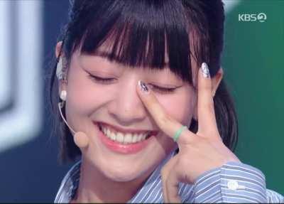 Jihyo - face close up, light eyes, blue shirt, ✌️