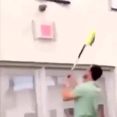 Desperately trying to get this massive dildo off this school gym’s wall