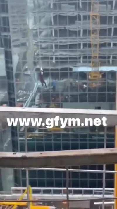Dude hanging from a crane (multiple angles)